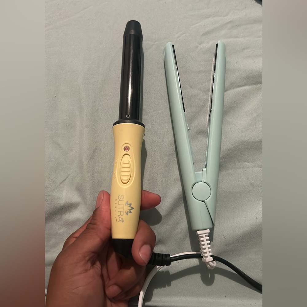 Travel size hair iron and curling iron.